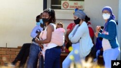 People queue to be tested for COVID-19 at the Livingstone Hospital in Port Elizabeth, South Africa, Nov. 13, 2020.