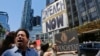 Protesters rally outside a Trump hotel to call for the impeachment of President Donald Trump, July 2, 2017, in New York.