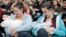 FILE - Mothers feed their babies in Paris, Oct. 11, 2008, during a worldwide breastfeeding event. 