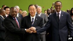 United Nations Secretary-General Ban Ki-moon, center, joins hands with President of the Democratic Republic of Congo Joseph Kabila Kabange, left, and President of Rwanda Paul Kagame at the 67th session of the U.N. General Assembly, Sept. 27, 2012.
