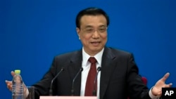 中國新任總理李克強星期日在北京人民大會堂全國人民代表大會閉幕式後舉行新聞發佈會