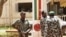 Malian junta soldiers stand guard at their headquarters in Kati, outside Mali's capital Bamako, April 1, 2012.