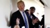 FILE - U.S. President Donald Trump speaks to reporters aboard Air Force One after visiting White Sulphur Springs, West Virginia, April 5, 2018.