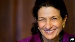 Sen. Olympia Snowe, R-Maine smiles on Capitol Hill in Washington, Thursday, Dec. 13, 2012 after delivering her farewell speech to the Senate. 