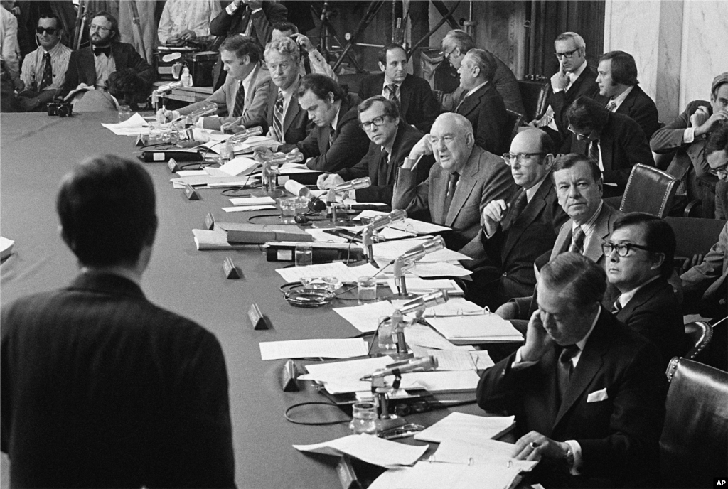 Members of the Senate Watergate Investigating Committee are seen during a hearing on Capitol Hill in Washington as they listen to witness Robert Odle, foreground, in this May 17, 1973 photo. (AP Photo)