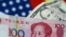 FILE - U.S. dollar and China yuan notes are seen in this illustration, June 2, 2017. This June, the yuan is set for its biggest monthly fall on record.