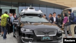 Беспилотный автомобиль компании Pony.ai, во время организованного китайским правительством тура по району Большого залива Гуандун-Гонконг-Макао в Гуанчжоу, Китай, 28 февраля 2019 г.