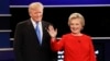 FILE- Republican presidential nominee Donald Trump and Democratic presidential nominee Hillary Clinton are introduced during the first presidential debate at Hofstra University in Hempstead, N.Y., Sept. 26, 2016. 