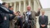 Michael Carvin, center, lead attorney for the petitioners, speaks to reporters outside the Supreme Court in Washington, March 4, 2015.