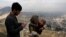 FILE - A child receives polio vaccination drops during an anti-polio campaign in Kabul, Afghanistan.