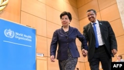 Daarektera WHO lammii Chaaynaa bara huji fixatte, Margaret Chaan fi daarektea haaraa dhaaba kanaa Dr.Tewodiroos Adihaanom.
