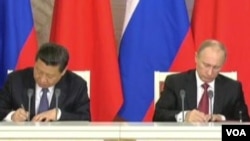 俄羅斯總統普京與中國國家主席習近平今年三月會晤 (美國之音視頻截圖)