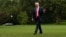 U.S. President Donald Trump walks across the South Lawn after arriving via Marine One helicopter at the White House in Washington, Aug. 14, 2017. 