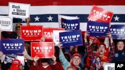 FILE - Supporters cheer as President Donald Trump speaks during a campaign rally, Friday, Feb. 28, 2020, in North Charleston, S.C.