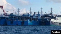 菲律賓方面發布照片：眾多中國船隻停泊在南中國海有爭議的牛軛礁附近。 （2021年3月27日）