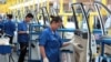 Employees work at a production line inside a factory of Saic GM Wuling, in Liuzhou, Guangxi Zhuang Autonomous Region, China, June 19, 2016. 