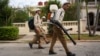 FILE - Government fumigators prepare to spray homes for mosquitoes in Havana, Cuba, Feb. 22, 2016.