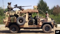 French special forces drive through the city of Gao, Northern Mali, Jan. 30, 2013. 