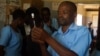 A medical worker at Likuni Community Hospital, in Lilongwe, Malawai draws the malaria vaccine into a syringe for vaccination.