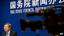 中国商务部副部长王受文2018年6月28日参加新闻发布会，就最新发表的《中国与世界贸易组织》白皮书介绍情况(美联社)
