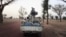 Militiaman from the Ansar Dine Islamic group ride on an armed vehicle between Gao and Kidal, northeastern Mali, June 12, 2012.