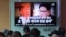 People watch a TV screen showing images of U.S. President Donald Trump, left, and North Korean leader Kim Jong Un during a news program at the Seoul Railway Station in Seoul, South Korea, May 25, 2018. 