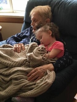 Connie Lambert’s favorite job is watching her two great-granddaughters. Here she is napping with the 2-year-old.