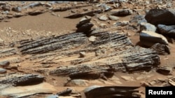 FILE - An image from NASA's Mars rover Curiosity shows the surface of the planet in this NASA handout released January 15, 2013.
