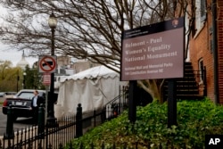 President Barack Obama's limousine sits in front of the newly designated Belmont-Paul Women’s Equality National Monument, formerly known as the Sewall-Belmont House and Museum, in Washington, April 12, 2016.