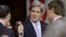 Senate Foreign Relations Chairman Senator John Kerry, President Barack Obama's nominee to become secretary of state, gives a 'thumbs-up' as he arrives before his confirmation hearing to testify before the committee to replace Hillary Rodham Clinton, on Ca