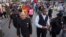 Hashim Nzinga, front left, a marcher who identified himself as national chairman of the New Black Panthers, marches with others in Charleston, to the Emanuel AME Church, six days after a gunman shot nine people inside the building, June 23, 2015.