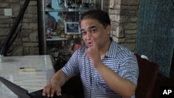 伊力哈木2013年5月在北京接受採訪