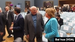 A man talks on&nbsp; his phone at a hospital in Quetta, Pakistan after a roadside bomb struck a security vehicle, killing at least four people.