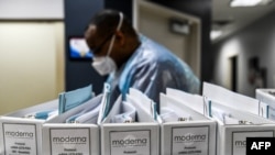 FILE - Biotechnology company Moderna protocol files for COVID-19 vaccinations are kept at the Research Centers of America in Hollywood, Florida, Aug. 13, 2020.