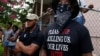 A demonstrator stands during protests in Baton Rouge, Louisiana, U.S., July 10, 2016. 