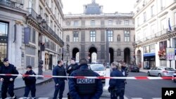 A farmer harvests rice on a field in Lalitpur, Nepal.