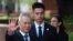 Chinese Vice Premier Liu He (L) arrives at the the Office of the United States Trade Representative for tariff negotiations in Washington DC on May 9, 2019.