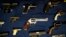 FILE - Guns seized by the police are displayed during a news conference in New York.