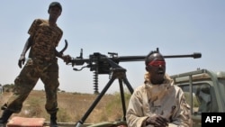 ፋይል ፎቶ - በአፍሪቃ ኅብረት ሠራዊት የሚታገዙት የሶማልያ ወታደሮች እ.አ.አ 2014 