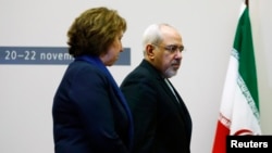 欧盟外交政策负责人阿什顿与伊朗外长扎里夫抵达日内万谈判地点