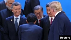 特朗普（右一）與習近平（右二）2018年11月30日在G20峰會上碰面（路透社）