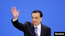 中國總理李克強抵達在北京人大會堂全國人大會議閉幕後舉行的記者會。（2019年3月15日）