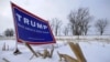 A campaign sign for Republican presidential candidate Donald Trump is seen on the side of the road in Mt. Ayr, Iowa, Jan. 22, 2016. 