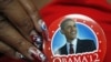 A delegate shows off her Barack Obama button in the convention hall before the Democratic National Convention in Charlotte, North Carolina, Sept. 3, 2012. 