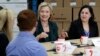Democratic presidential candidate Hillary Rodham Clinton, center, speaks during a small business roundtable, April 15, 2015, in Norwalk, Iowa.