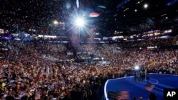 President Barack Obama, first lady Michelle Obama, their children Malia and Sasha, and Vice President Joe Biden and his wife Jill Biden, wave on stage on the final day of the Democratic National Convention in Charlotte, N.C., Thursday, Sept. 6, 2012.