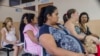 FILE - Women wait their turn for their pre-natal exams at the National Hospital for Women in San Salvador, El Salvador, Jan. 29, 2016.