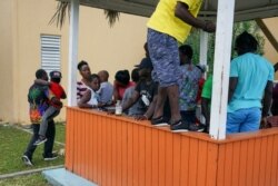 Hurricane Dorian refugees, many of them from Great Abaco, pass the time at a shelter set up at the Kendal G.L. Isaacs National Gymnasium in Nassau, New Providence, Bahamas, Sept. 10, 2019.