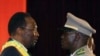 Mali's Interim President Dioncounda Traore, left, is congratulated by coup leader Amadou Sanogo after being sworn in at a ceremony in Bamako, Mali, April 12, 2012. 