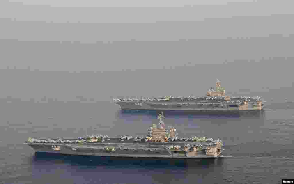 2014年10月18日，美国航空母舰卡尔文森豪和布什号换防。布什号以老布什命名